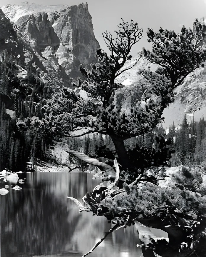 After AI enhancement (2x upscale): low-resolution 1938 photo of a mountain lake